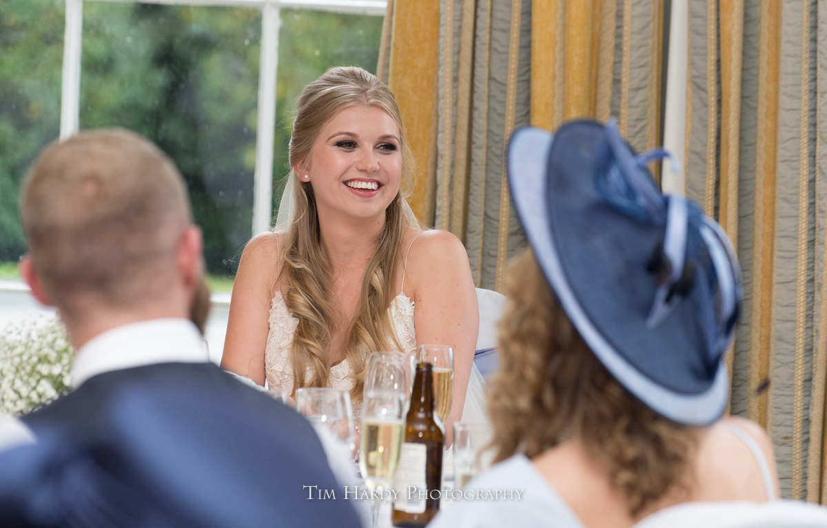 happy bride during the speeches